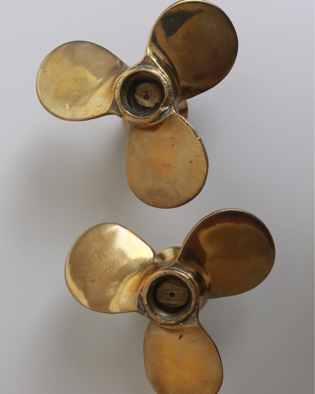 WWI Brass Propeller Candlestick Holders – Trench Art Pair, Sculptural Nautical Form - The Estate